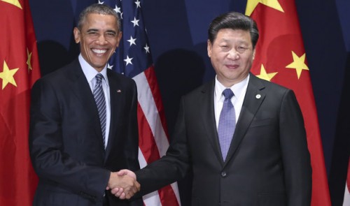PARIS, Nov. 30, 2015-- Chinese President Xi Jinping, right, meets with his U.S. counterpart Barack Obama in Paris, France, Nov. 30, 2015. (Xinhua/Lan Hongguang via Getty Images)