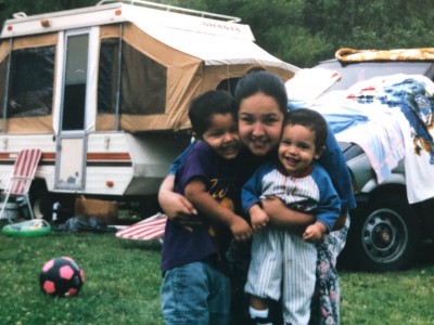 Me, my older brother, and my mom on a camping trip (I'm the cute one to the right).